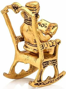 Golden Lord Ganesha Statue Sitting on a Rocking Chair and Reading Ramayan | Decorative Showpiece